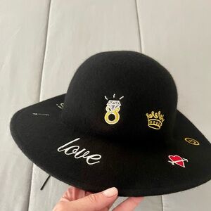 Black Wide-Brimmed Hat with Decorative Pins